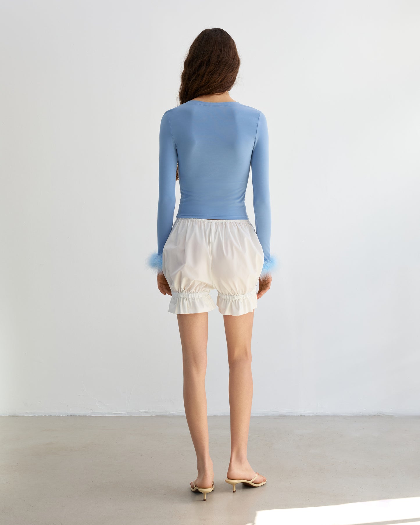 Blue longsleeve with feathers