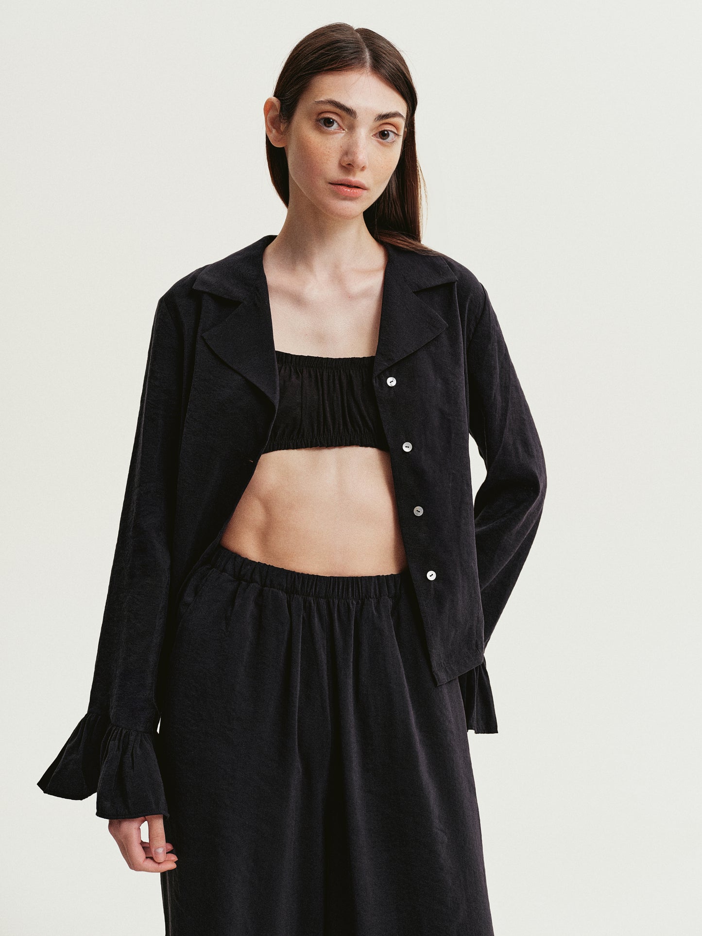 Black blouse with ruffles