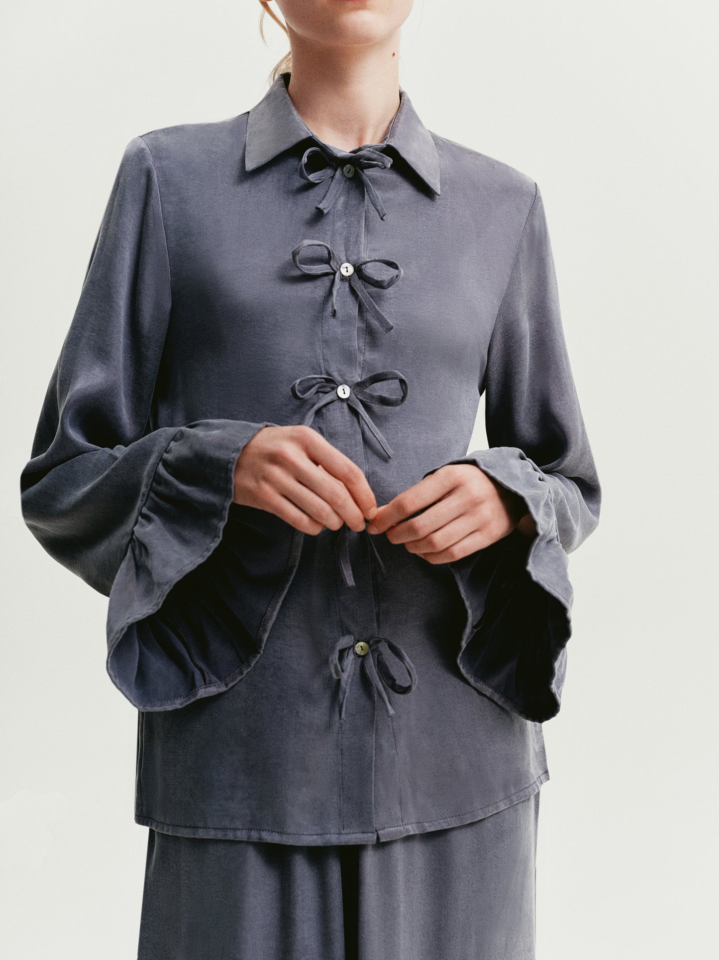Blue-gray blouse with ruffles