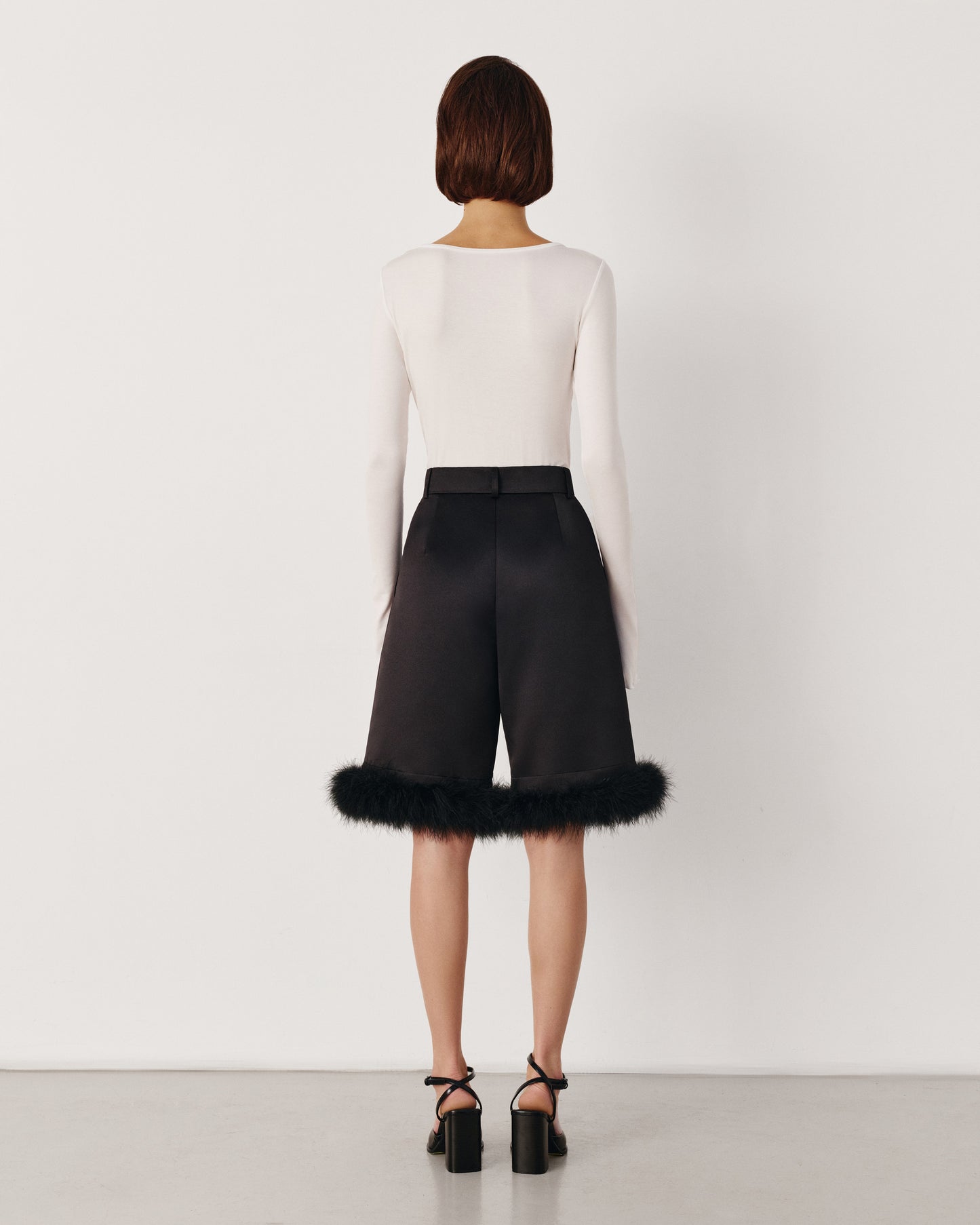 Black Bermuda shorts with puff