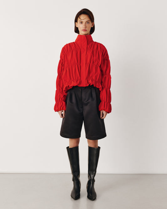 Red draped bomber jacket
