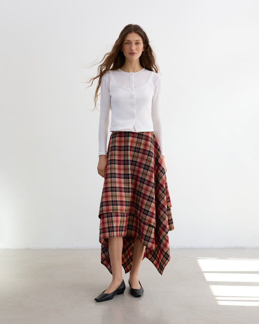 Asymmetric spring check skirt