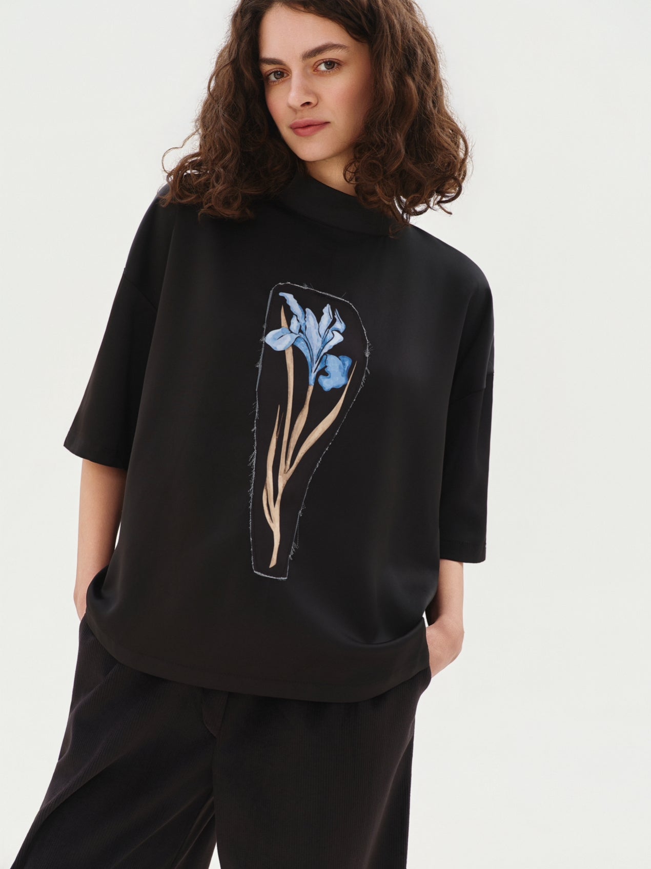 Black blouse with blue flower